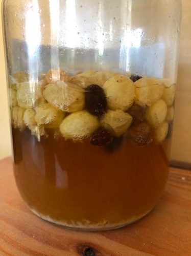 Jar of bubbling wild yeast water